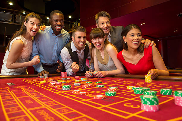 Live dealer at Caishen Wins table with card layout and betting positions